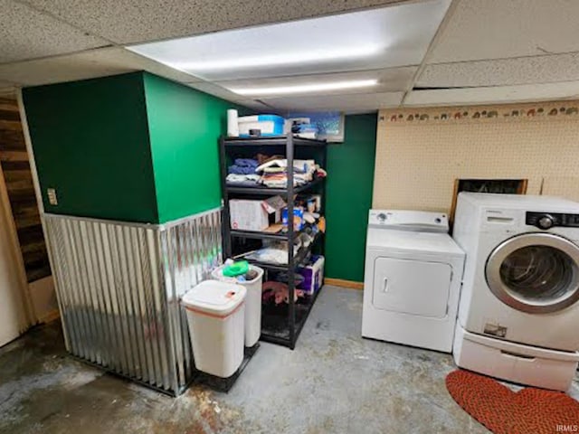 clothes washing area featuring washer and clothes dryer