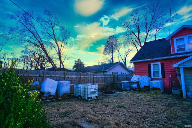 view of yard at dusk