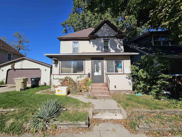 view of front of home featuring a front lawn and a garage