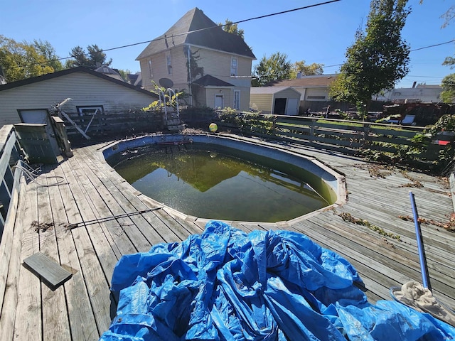 view of pool featuring a wooden deck