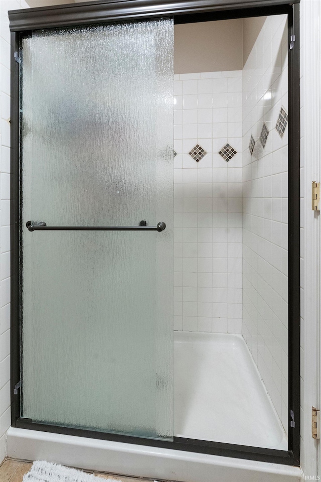 bathroom with an enclosed shower