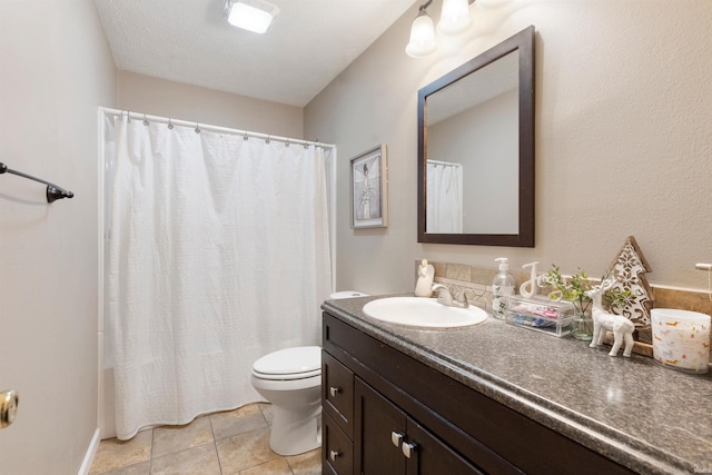 bathroom with tile patterned floors, vanity, and toilet