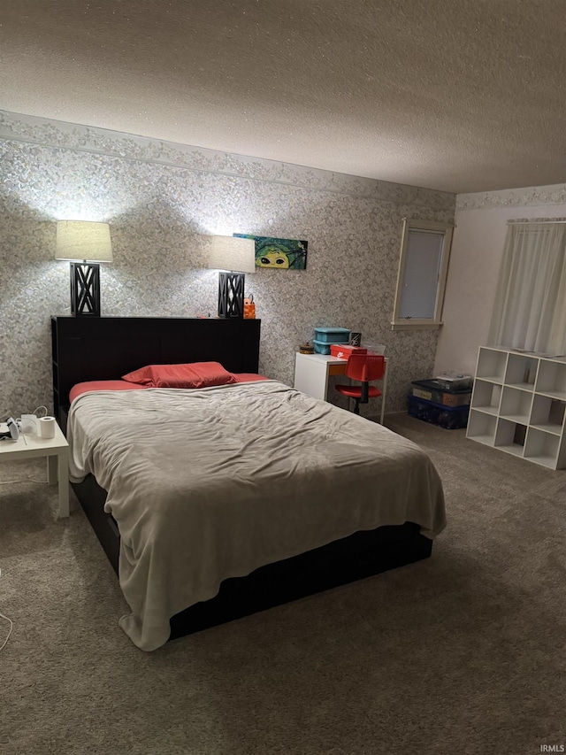 bedroom featuring carpet and a textured ceiling