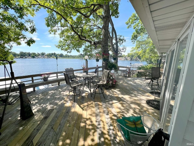 wooden deck with a water view