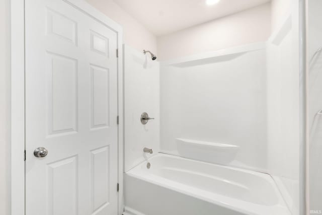 bathroom with bathing tub / shower combination