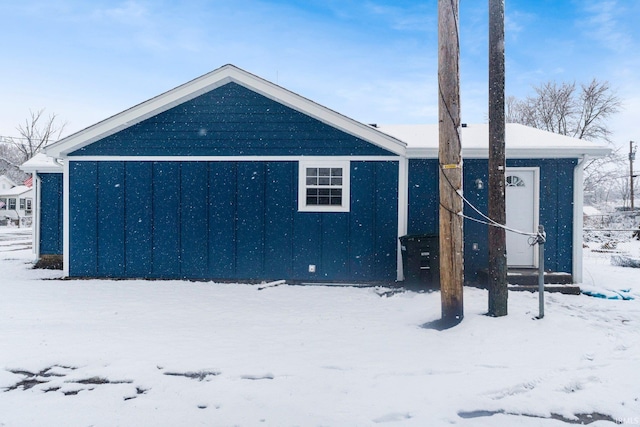 view of snow covered house