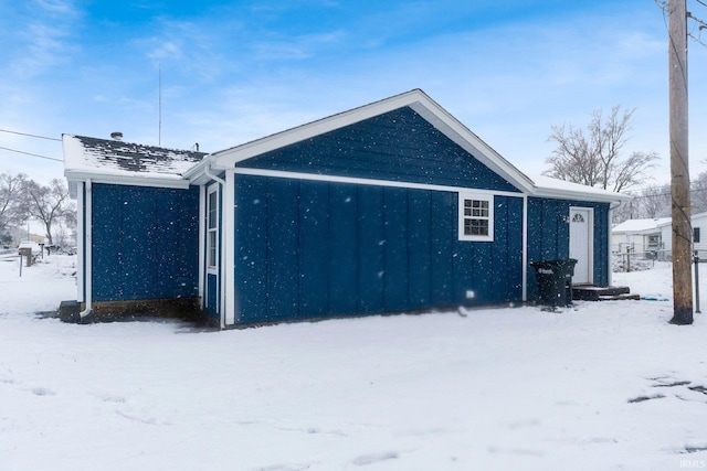 view of snow covered garage