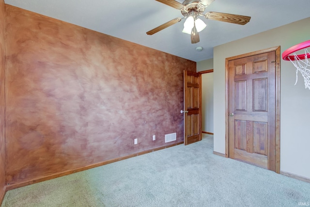 unfurnished bedroom with ceiling fan and light carpet