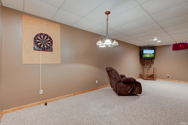 unfurnished room featuring carpet flooring and a paneled ceiling