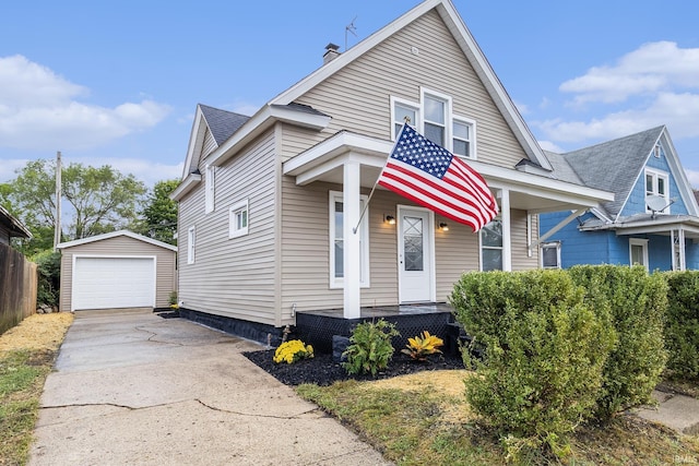 view of front of property with a porch, a garage, and an outdoor structure