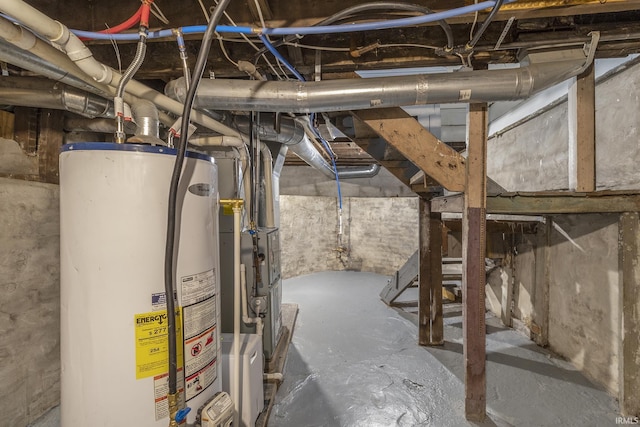 basement featuring heating unit and water heater