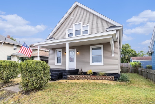 bungalow-style house with a front lawn and a porch