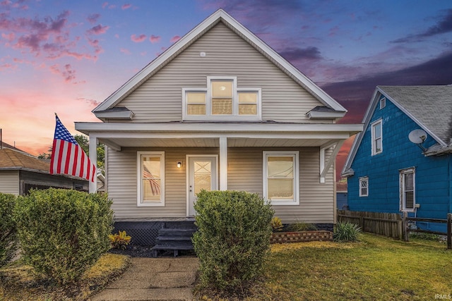 bungalow-style home with a lawn