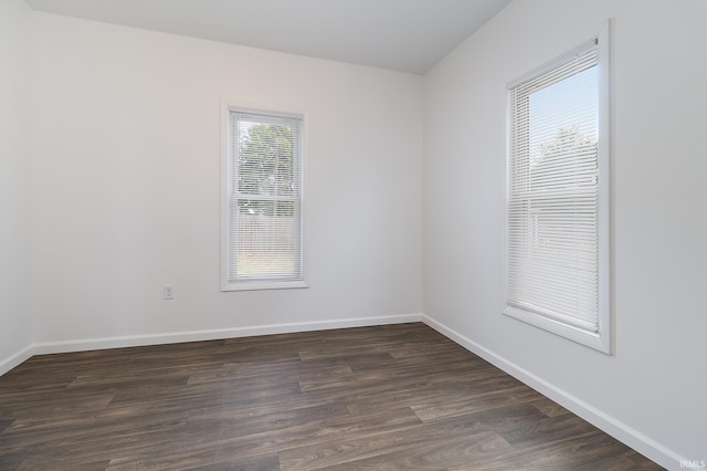 empty room featuring dark wood-type flooring