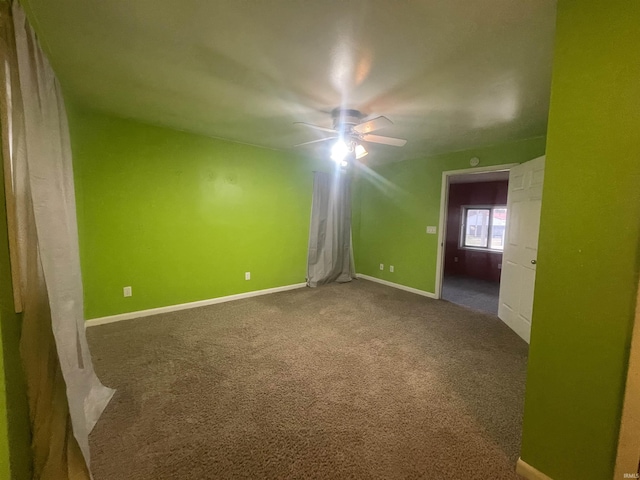 carpeted empty room with ceiling fan