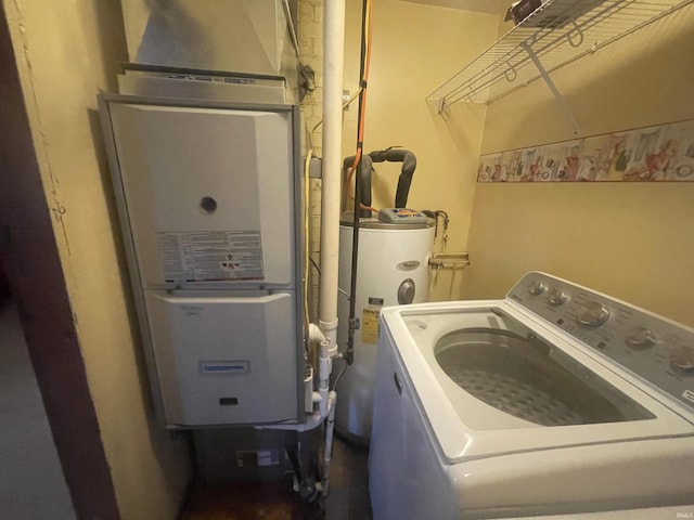 laundry area with washer / dryer, heating unit, and water heater