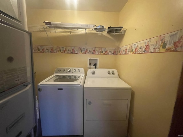 clothes washing area featuring washing machine and dryer