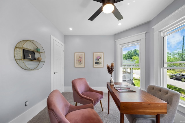 office area with ceiling fan and carpet