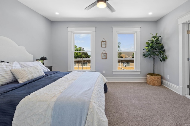 carpeted bedroom featuring ceiling fan