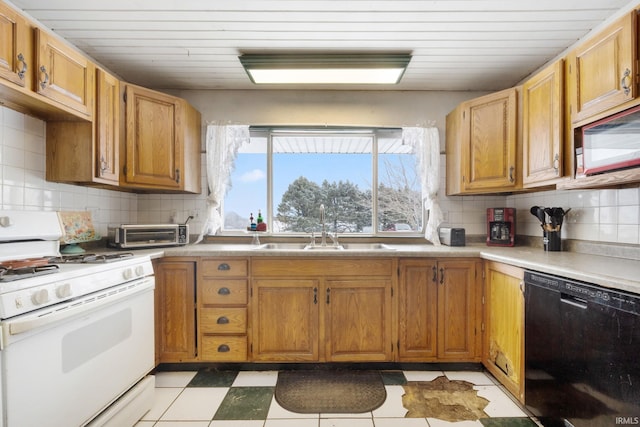 kitchen with dishwasher, tasteful backsplash, white gas range, and sink