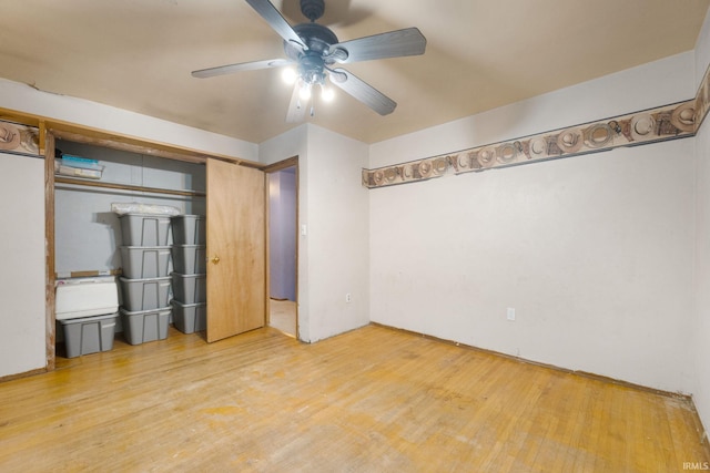 interior space featuring hardwood / wood-style floors and ceiling fan