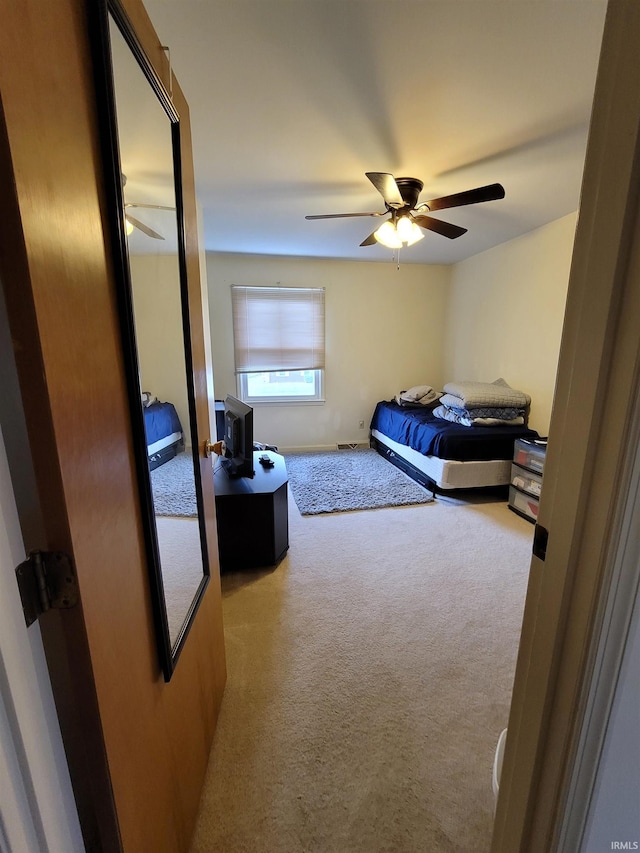 bedroom featuring ceiling fan and carpet floors