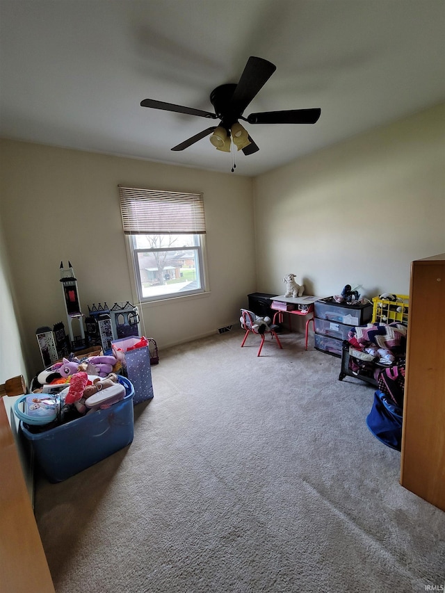 game room featuring ceiling fan and carpet