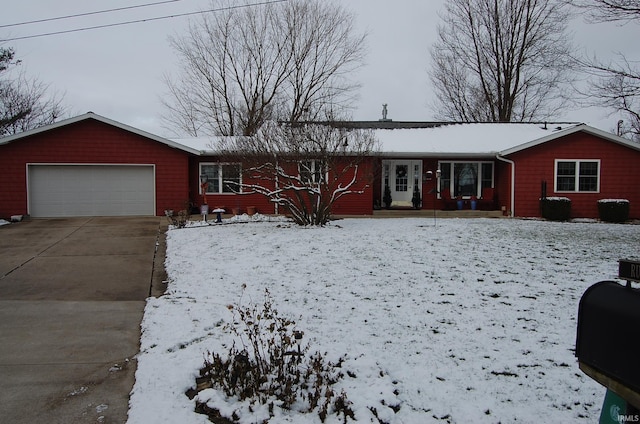 ranch-style house featuring a garage