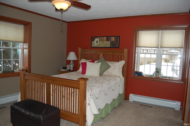 bedroom featuring carpet, ceiling fan, crown molding, and baseboard heating