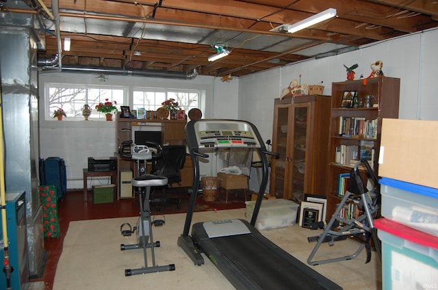 workout area featuring baseboard heating