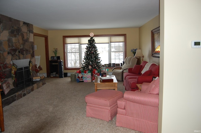 carpeted living room featuring a fireplace