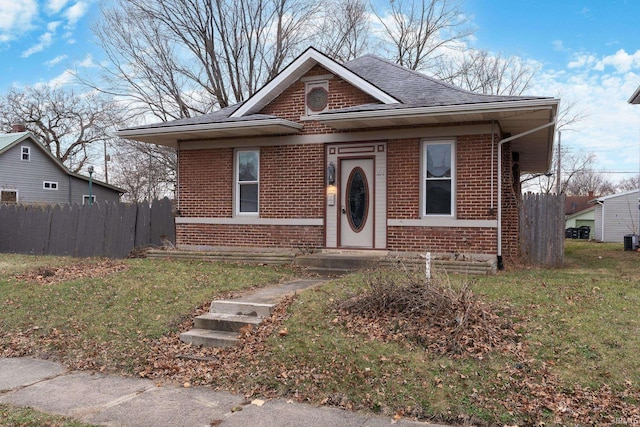 bungalow-style home featuring a front yard