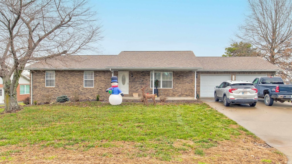 single story home with a garage and a front lawn