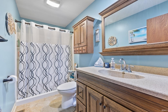 bathroom featuring vanity, a shower with shower curtain, and toilet