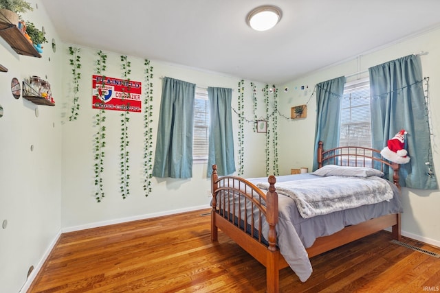 bedroom featuring hardwood / wood-style flooring