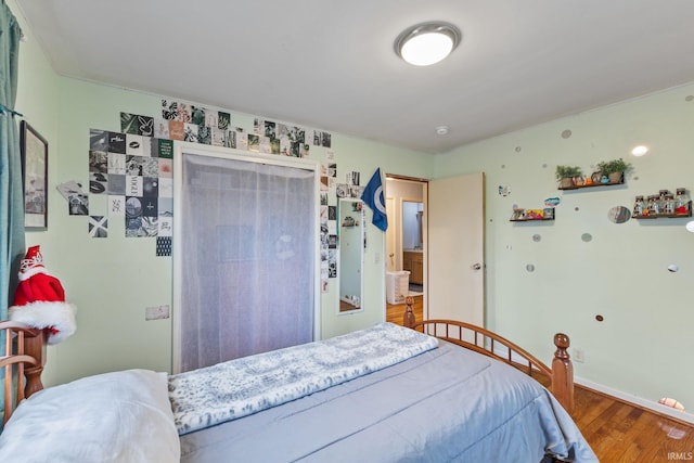 bedroom featuring wood-type flooring