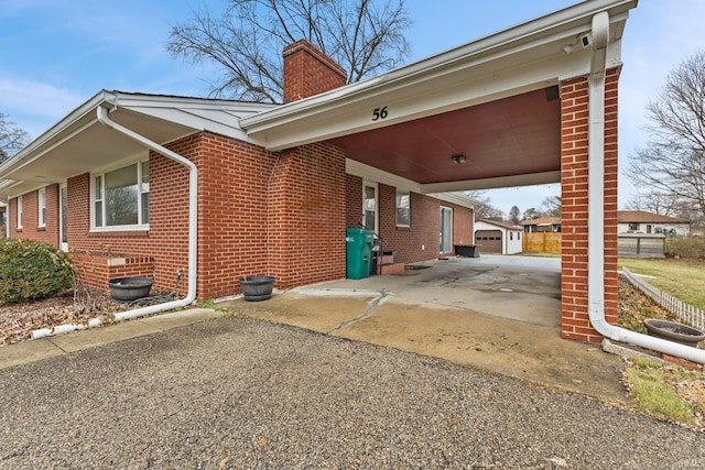 exterior space with a carport