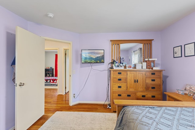 bedroom with hardwood / wood-style floors