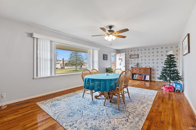 dining area featuring ceiling fan and hardwood / wood-style floors