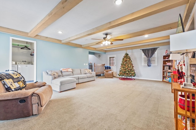 living room with beamed ceiling, independent washer and dryer, ceiling fan, and carpet