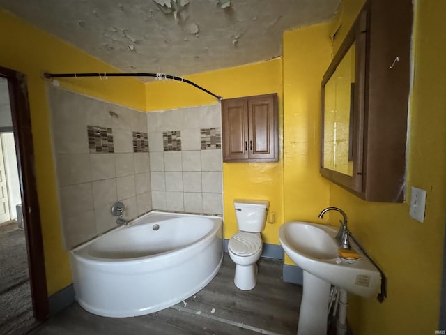 bathroom featuring hardwood / wood-style floors and toilet