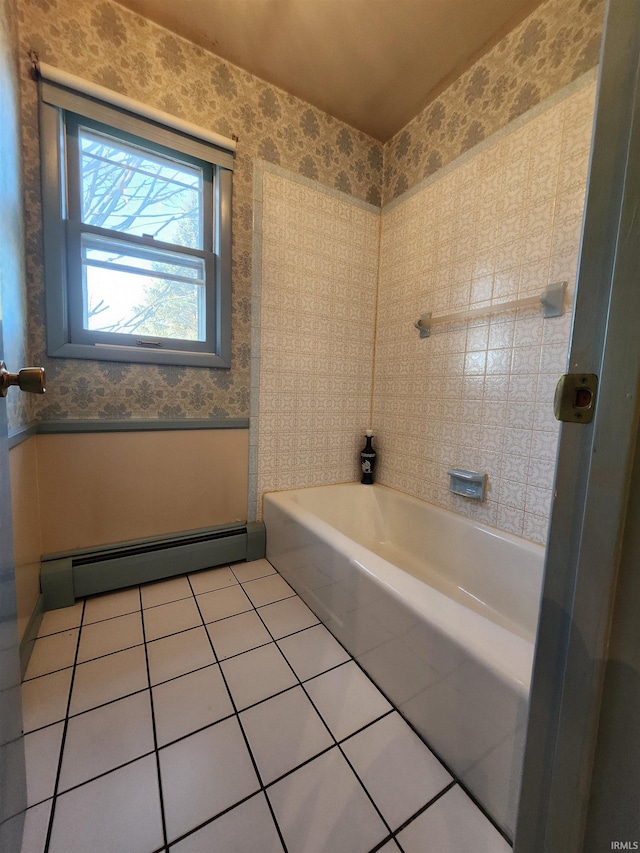 bathroom featuring a bath, tile patterned flooring, and a baseboard radiator