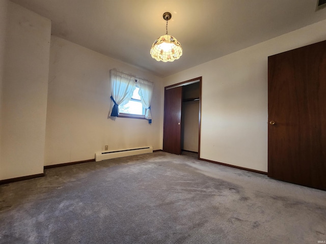 unfurnished bedroom with carpet, an inviting chandelier, and baseboard heating