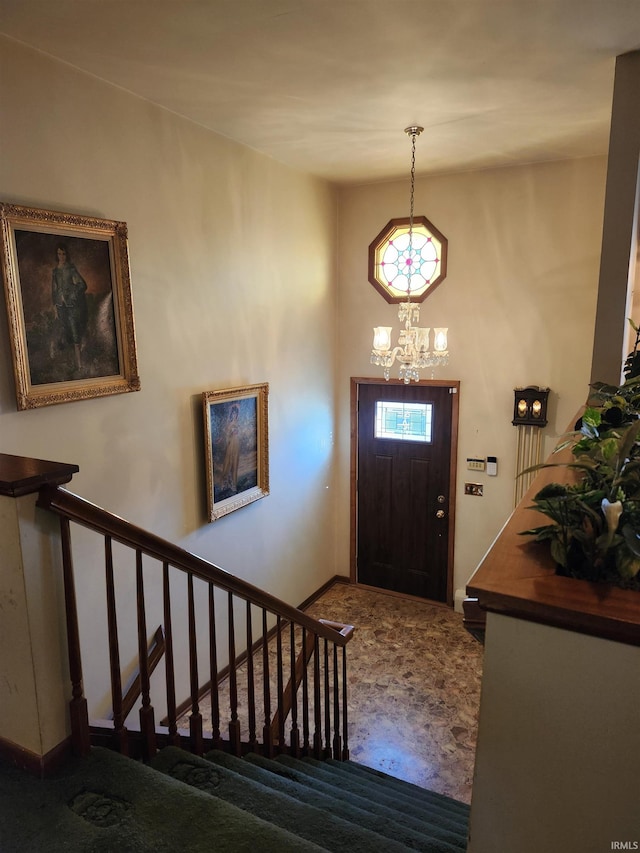 foyer with a notable chandelier