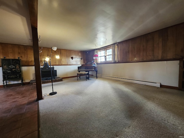 basement featuring dark carpet and a baseboard radiator