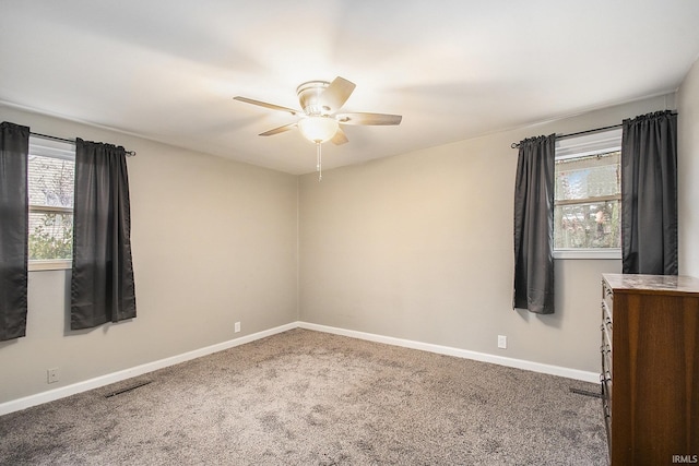 unfurnished room featuring carpet flooring and ceiling fan