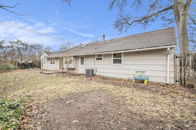 rear view of house featuring cooling unit