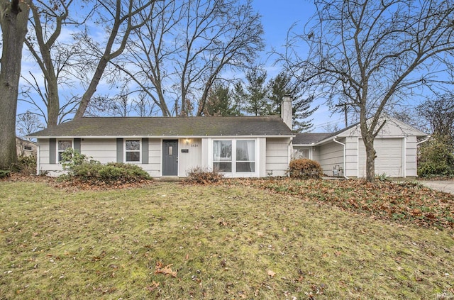 single story home with a garage and a front lawn