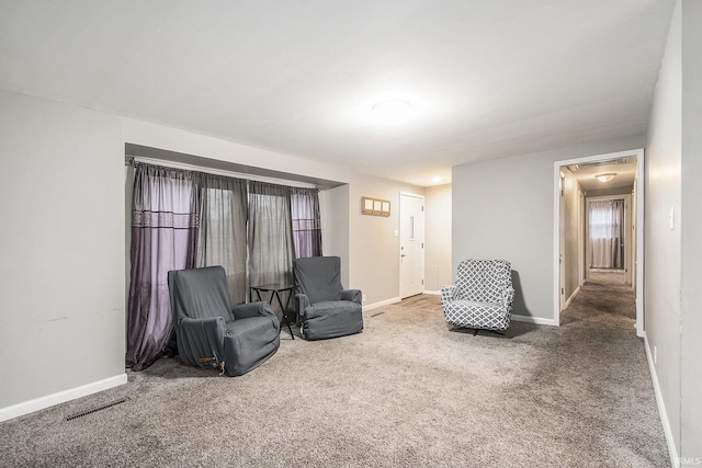 sitting room featuring carpet