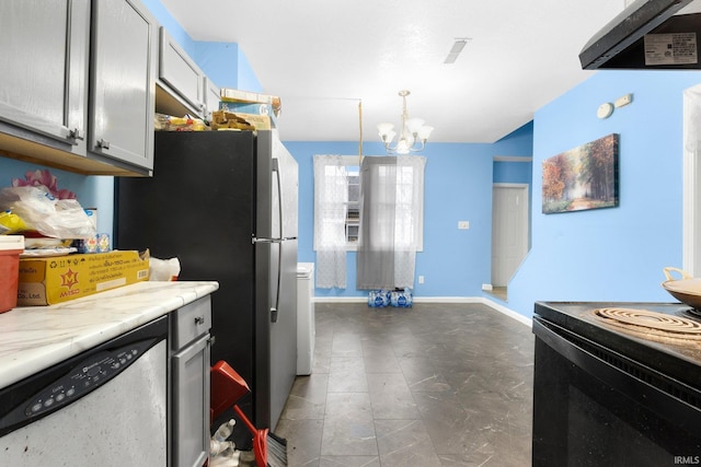 kitchen featuring appliances with stainless steel finishes, light stone counters, an inviting chandelier, gray cabinets, and hanging light fixtures